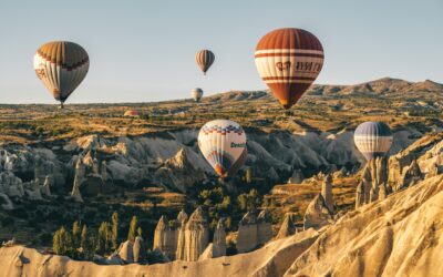 Colorful hot air balloons soaring in a clear blue sky